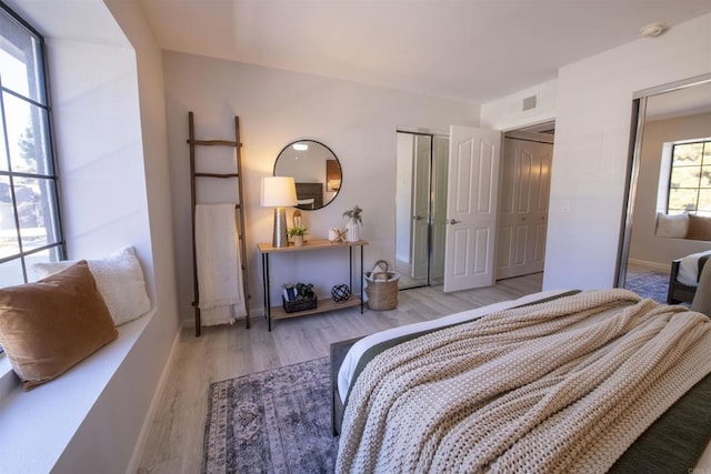 bedroom with light hardwood / wood-style flooring