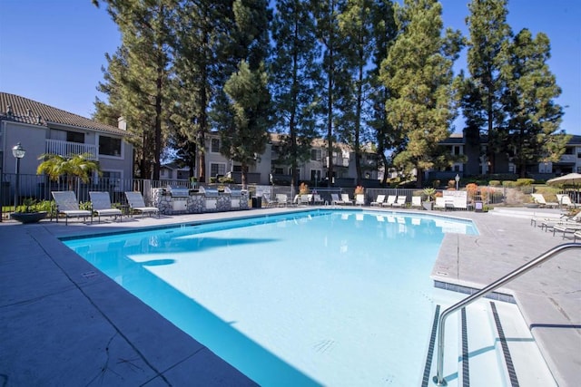 view of swimming pool with a patio area