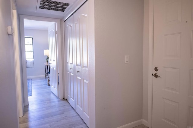 hallway with light wood-type flooring