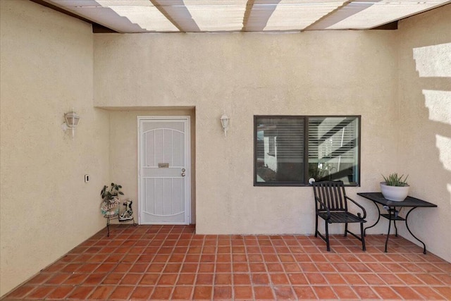 doorway to property featuring a patio