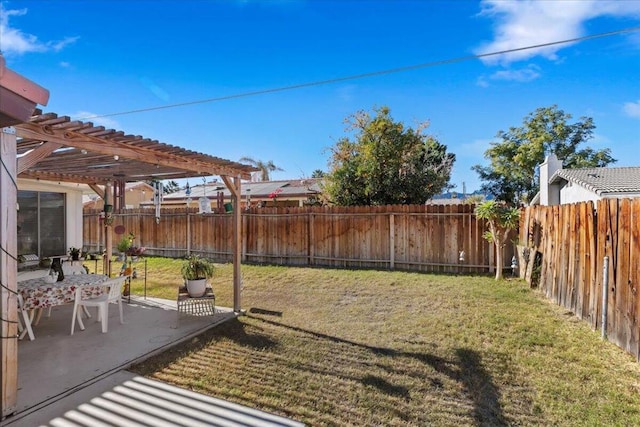 view of yard with a pergola and a patio area