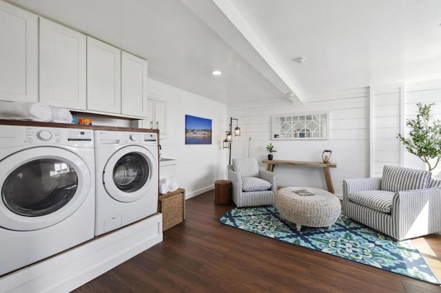 clothes washing area with cabinets, dark hardwood / wood-style flooring, and independent washer and dryer