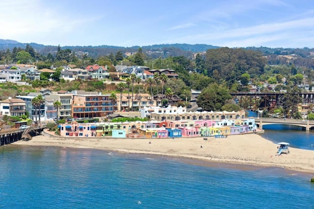 birds eye view of property with a beach view and a water view