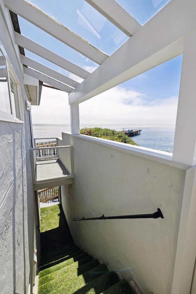 balcony featuring a water view