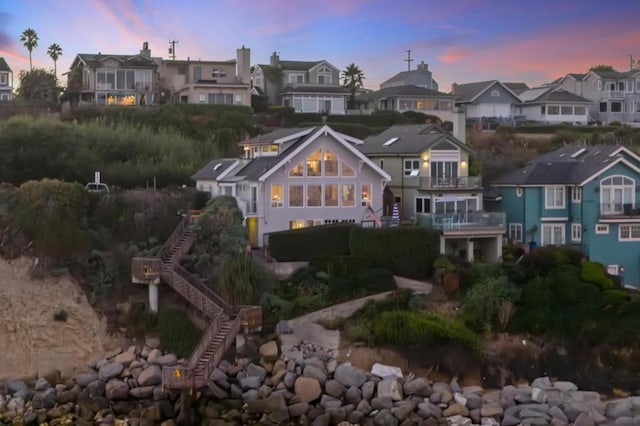 view of back house at dusk