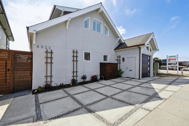 view of property exterior with a garage