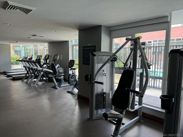 gym with a textured ceiling