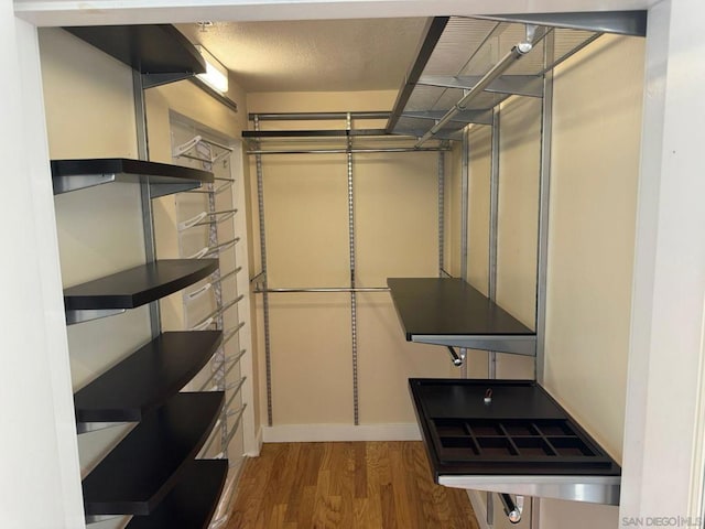 spacious closet featuring hardwood / wood-style floors