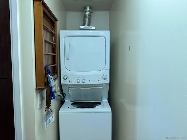 laundry room featuring stacked washer and dryer