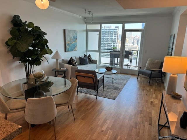 living room with ornamental molding and hardwood / wood-style floors