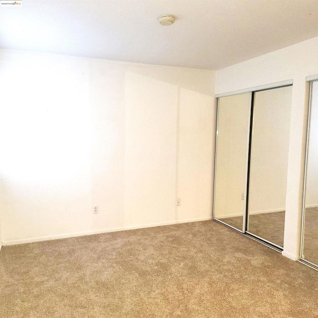 unfurnished bedroom with carpet