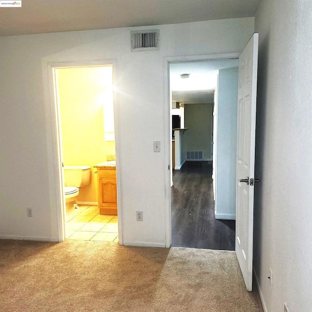 hallway featuring carpet