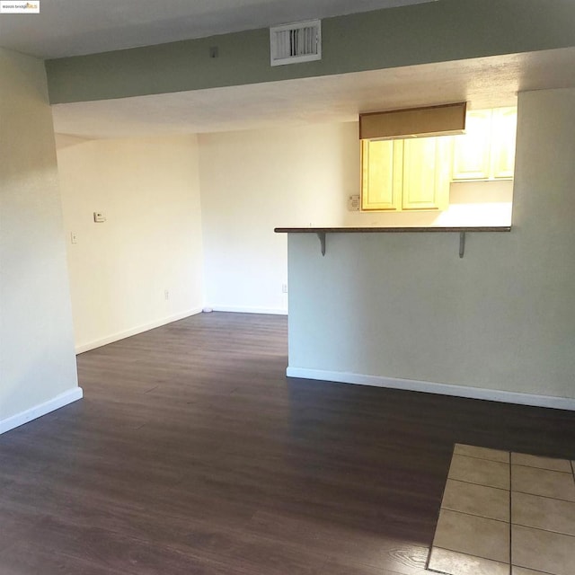 empty room featuring dark hardwood / wood-style flooring