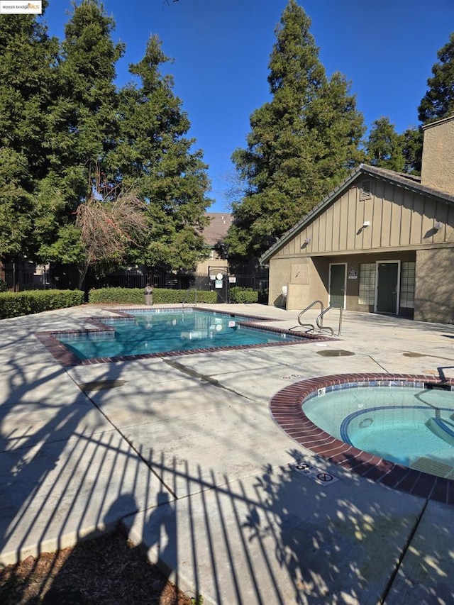 view of swimming pool featuring a patio