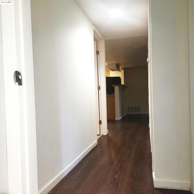 hallway featuring dark hardwood / wood-style floors