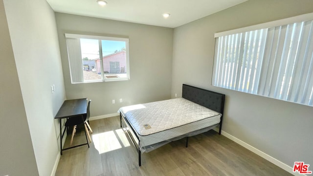 bedroom with light wood-type flooring