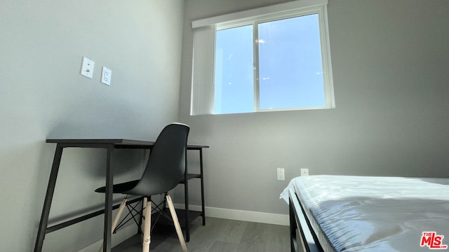 bedroom featuring wood-type flooring