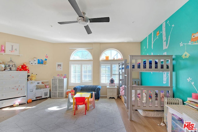 bedroom featuring light hardwood / wood-style flooring and ceiling fan