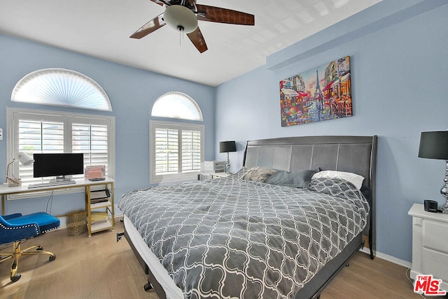 bedroom with ceiling fan and light wood-type flooring