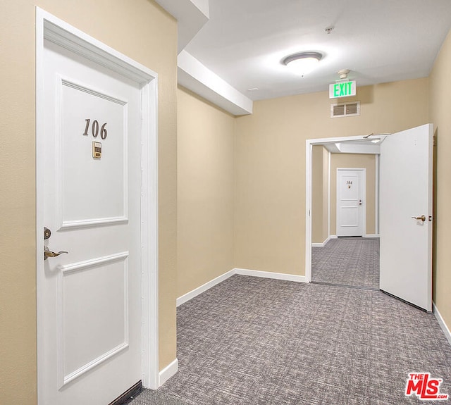 hallway featuring carpet flooring