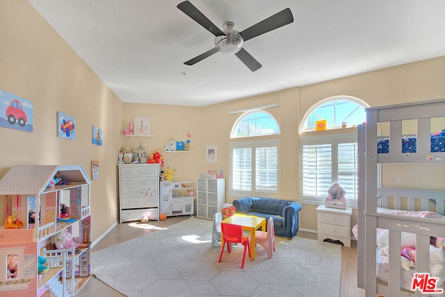 game room featuring ceiling fan and a healthy amount of sunlight