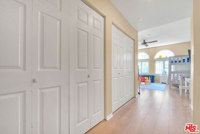 hall with light wood-type flooring