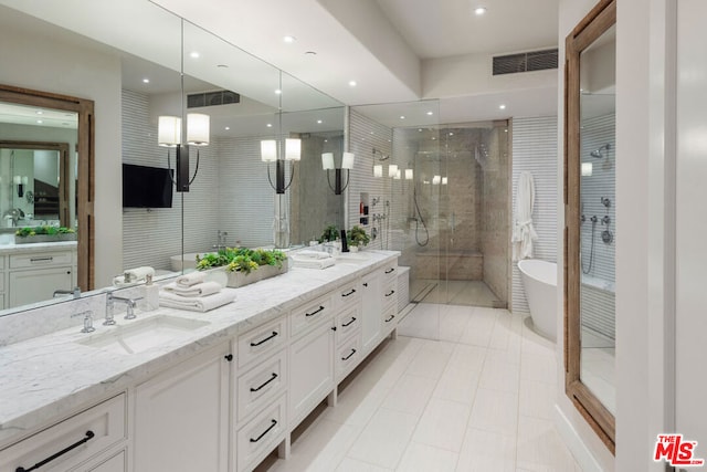 bathroom with vanity, tile patterned floors, and independent shower and bath