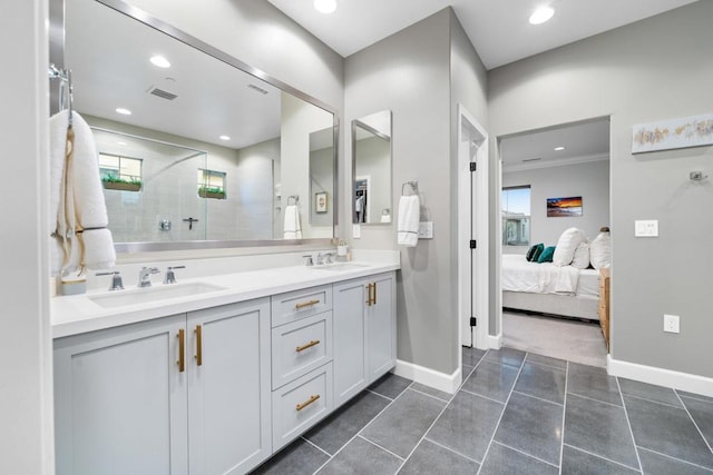 bathroom with a shower, plenty of natural light, and vanity