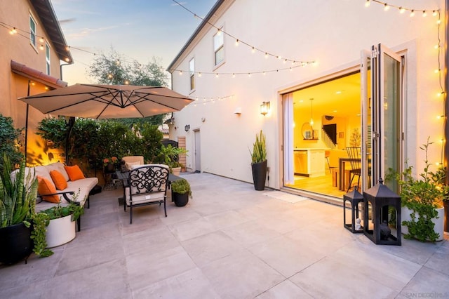 patio terrace at dusk with an outdoor living space