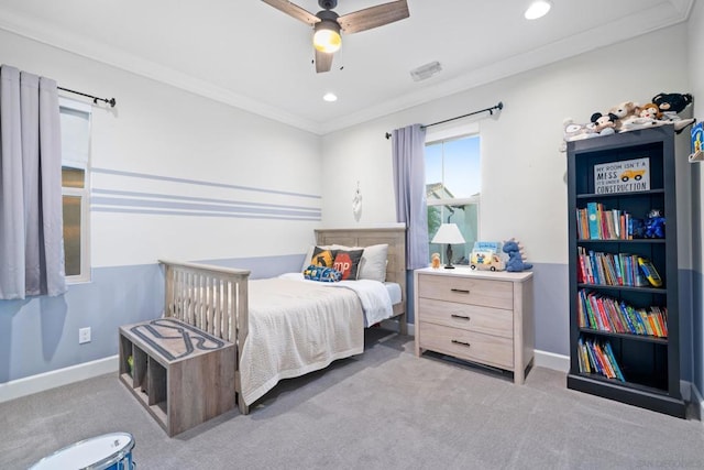 bedroom featuring ceiling fan, crown molding, and light carpet