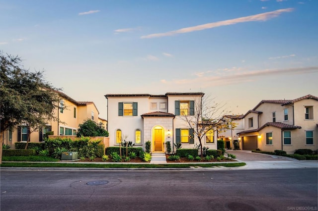 mediterranean / spanish-style home featuring a garage