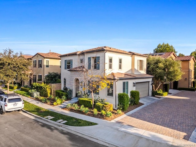 mediterranean / spanish house featuring a garage