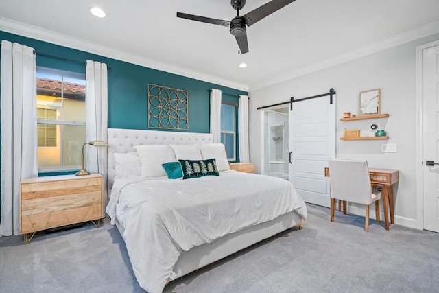 bedroom featuring ceiling fan, a barn door, crown molding, and carpet floors