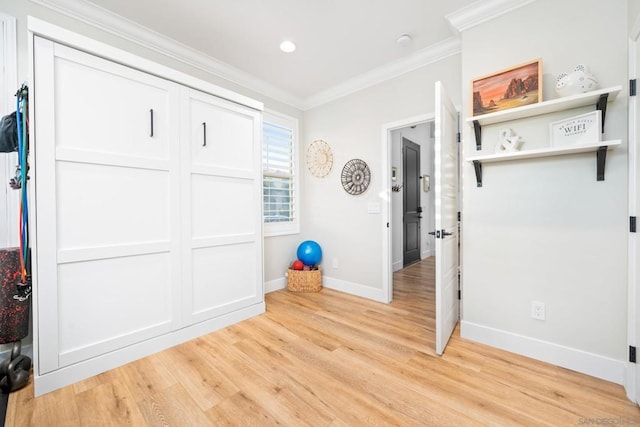 entrance foyer with light wood-type flooring and ornamental molding