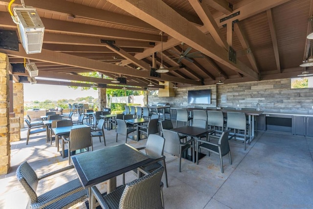 view of patio with ceiling fan and a gazebo