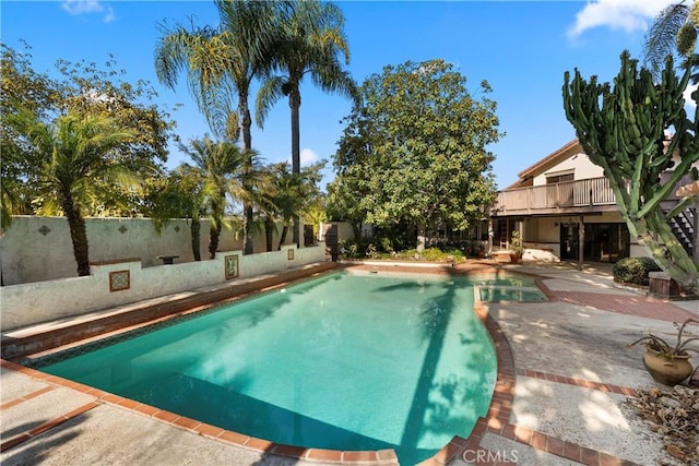 view of swimming pool with a patio area