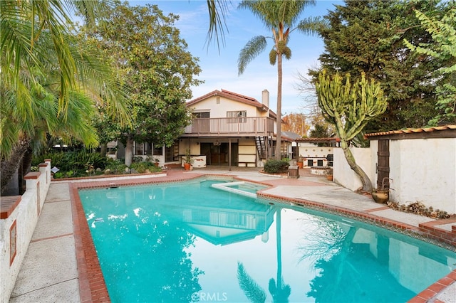 view of swimming pool with a patio