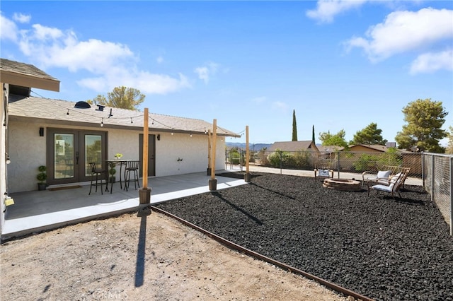 view of yard with a patio and french doors