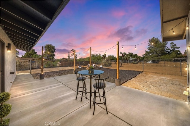 view of patio terrace at dusk