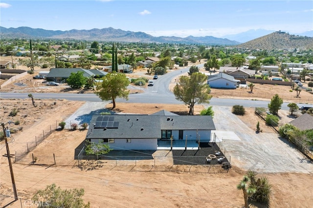 birds eye view of property with a mountain view