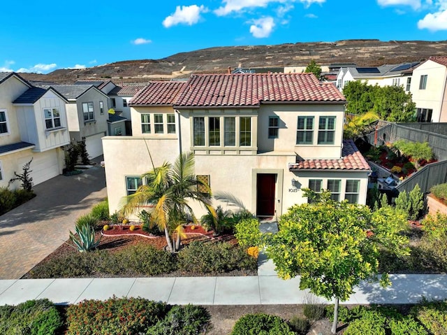 view of front of property featuring a mountain view and a garage