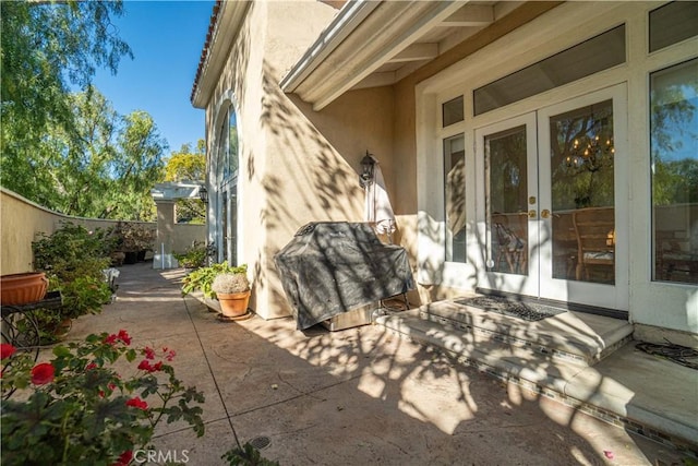 view of patio featuring french doors and a grill