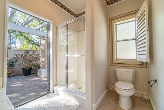 bathroom featuring toilet, walk in shower, and tile patterned floors