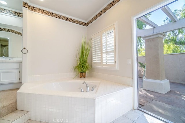 bathroom with vanity, tiled bath, and tile patterned floors