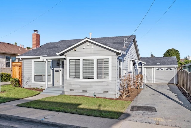 view of front of house featuring a garage and a front lawn