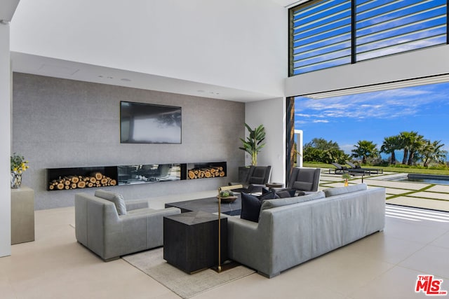 tiled living room featuring a healthy amount of sunlight