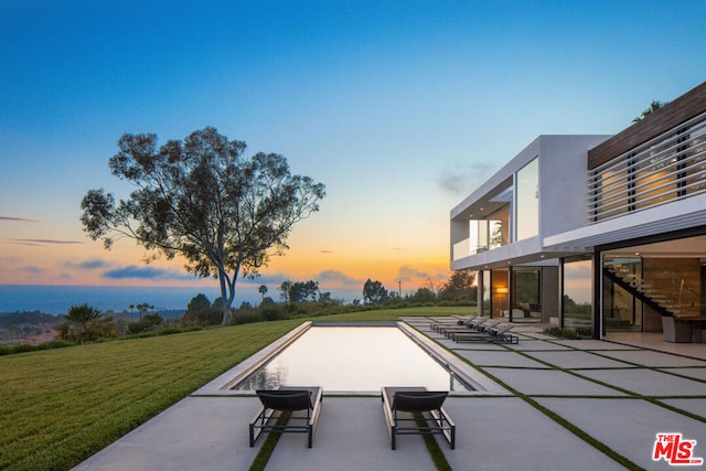 exterior space featuring a lawn and a patio