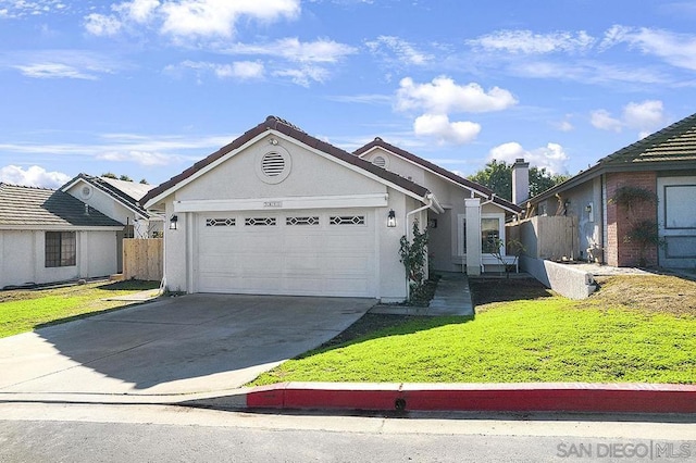 view of front of property with a front lawn and a garage