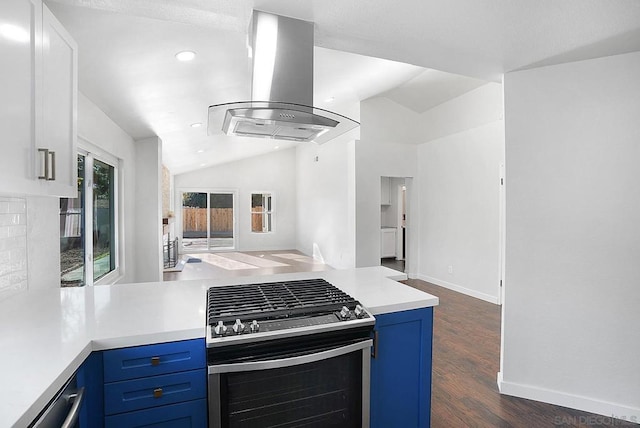 kitchen featuring lofted ceiling, stainless steel range oven, island exhaust hood, dark hardwood / wood-style floors, and blue cabinets