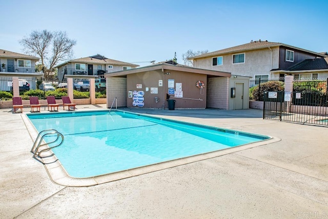 view of swimming pool with a patio